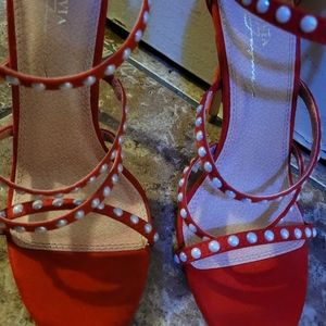 Red strappy heels with white beads